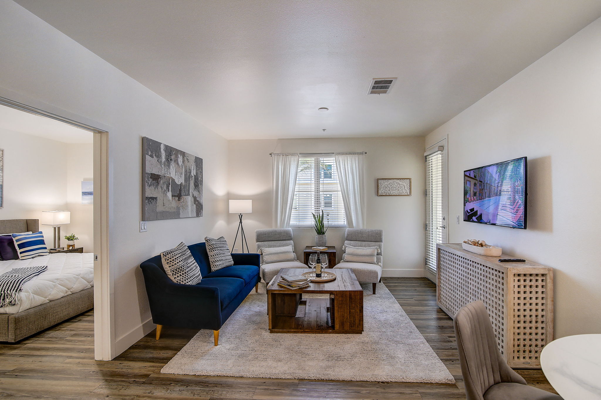 Cozy living room with a couch, chairs, and a coffee table.